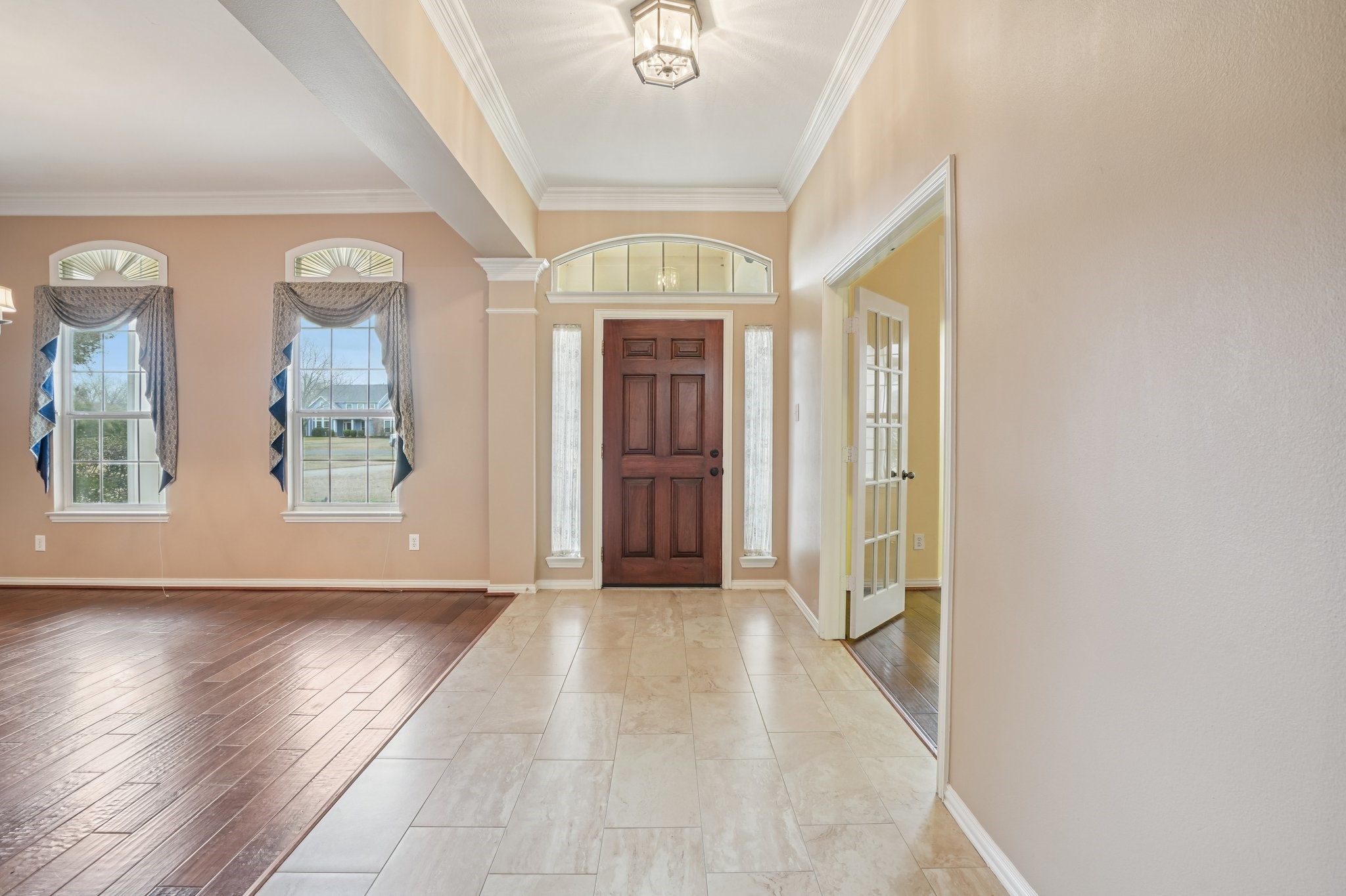 31810 Tree Farm Lane Fulshear, TX 77441 - Photo 8 of 48 an empty room with wooden floor and windows