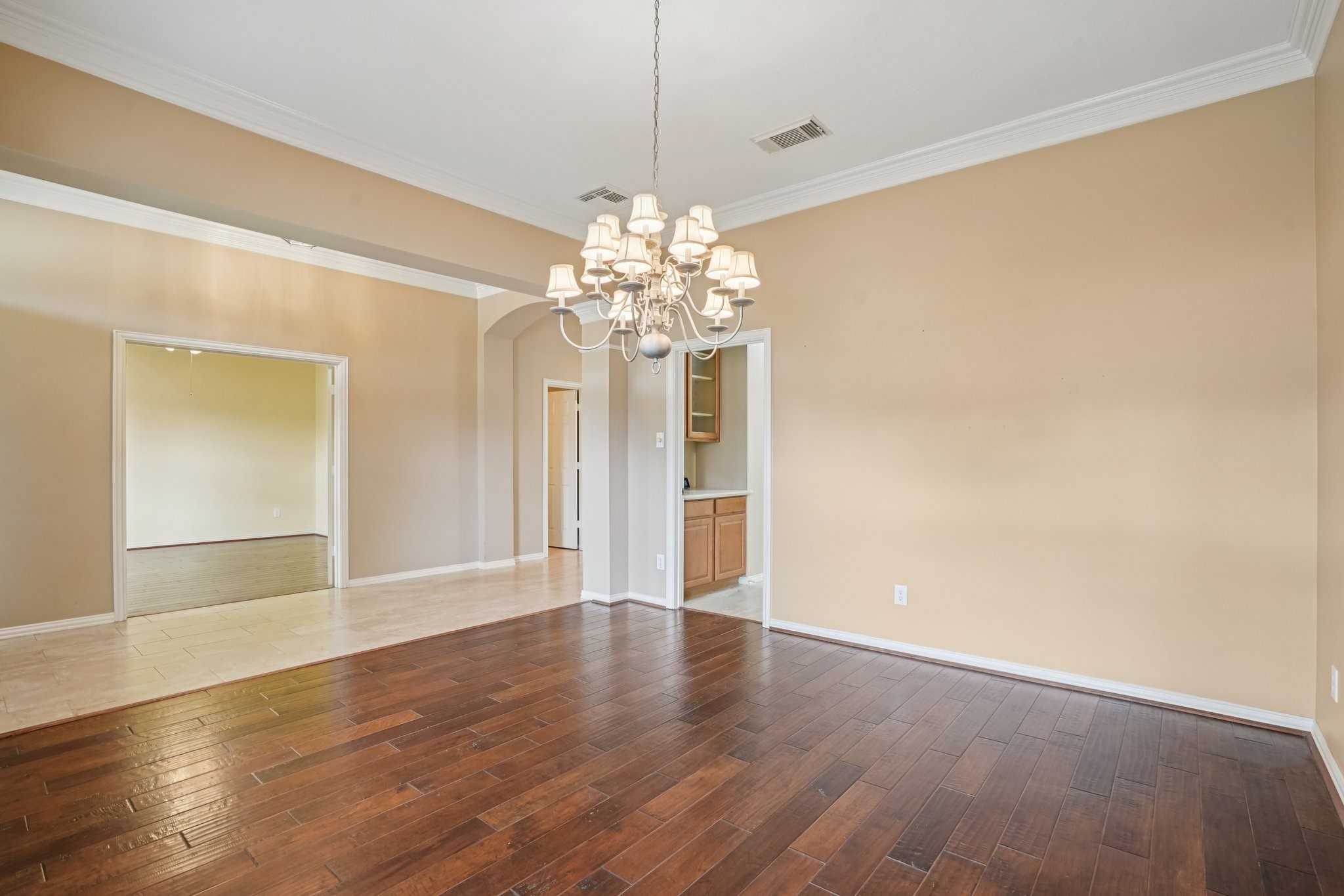 31810 Tree Farm Lane Fulshear, TX 77441 - Photo 9 of 48 a view of a big room with wooden floor chandelier and closet