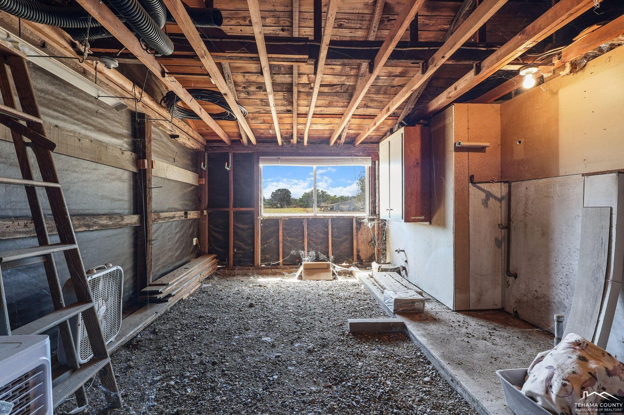 22275 Brent Road Red Bluff, CA 96080 - Photo 43 of 47 a view of an empty room with wooden floor and a window