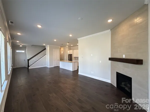 a view of an entryway with wooden floor