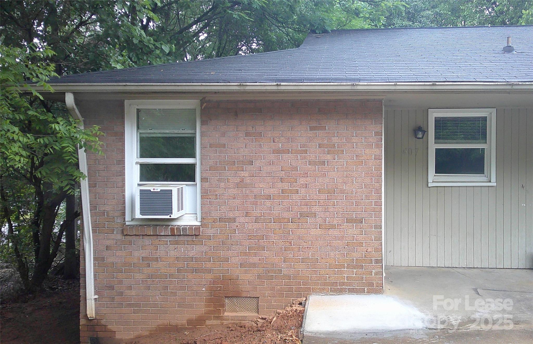 607 11th Street Southwest Hickory, NC 28602 - Photo 1 of 5 a front view of a house with a yard