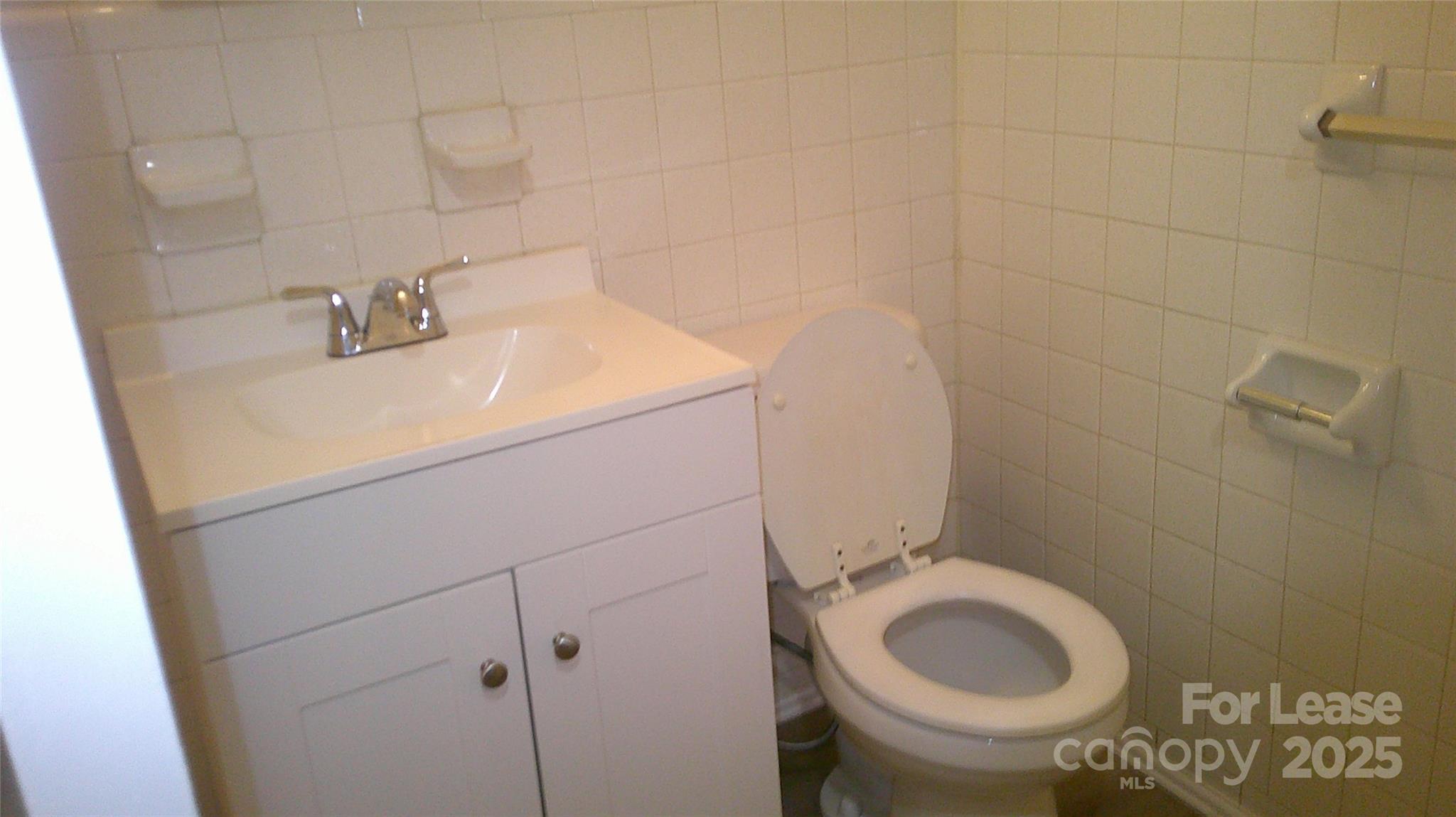 607 11th Street Southwest Hickory, NC 28602 - Photo 3 of 5 a bathroom with a sink and a toilet