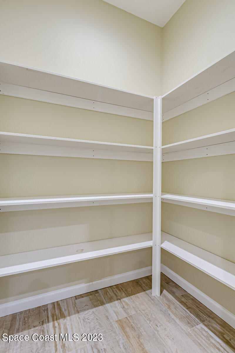 618 Hammock Road Melbourne, FL 32904 - Photo 11 of 59 a view of walk in closet with empty racks