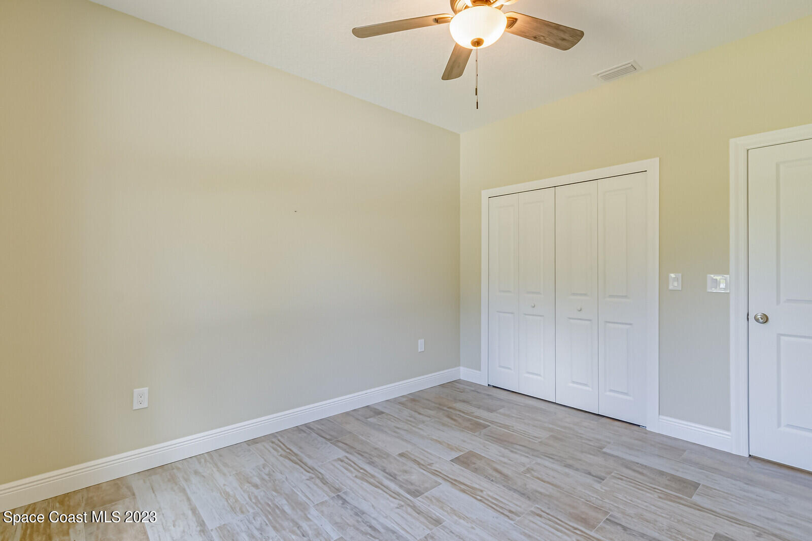 618 Hammock Road Melbourne, FL 32904 - Photo 26 of 59 a view of an empty room with wooden floor