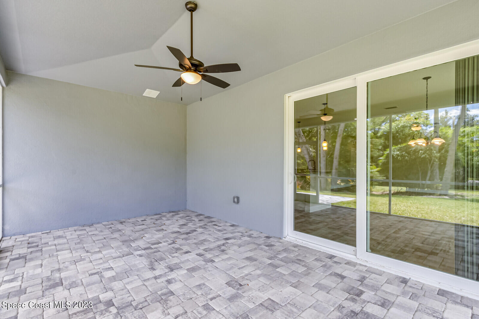 618 Hammock Road Melbourne, FL 32904 - Photo 31 of 59 a view of empty room with wooden floor and fan
