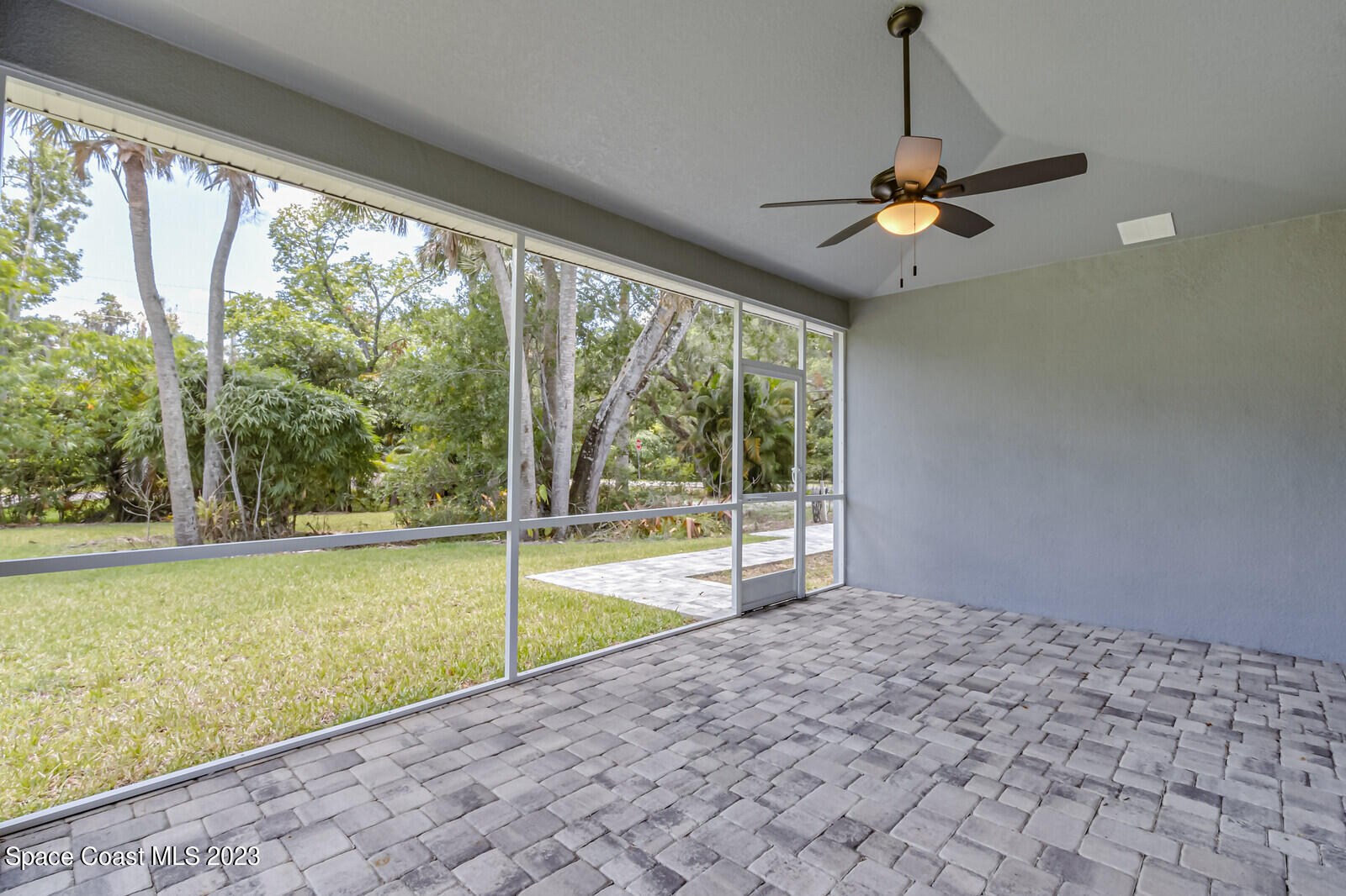 618 Hammock Road Melbourne, FL 32904 - Photo 32 of 59 a view of a room with a flat screen tv and outdoor space
