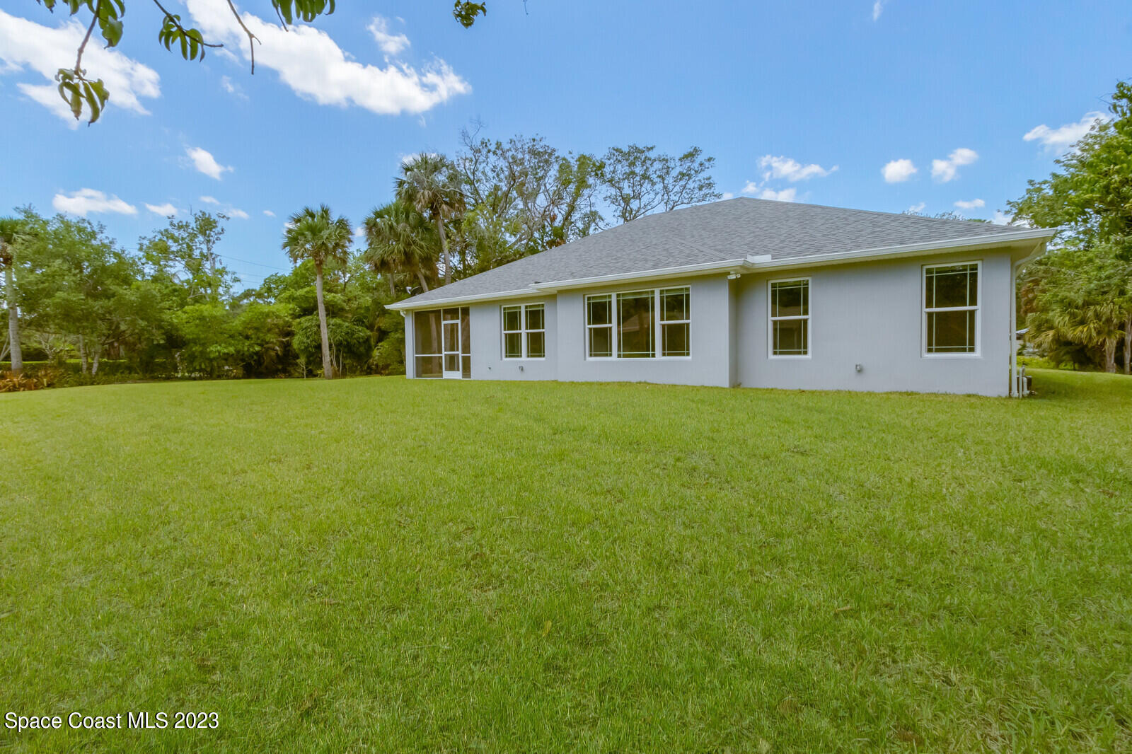 618 Hammock Road Melbourne, FL 32904 - Photo 33 of 59 a front view of house with yard and green space