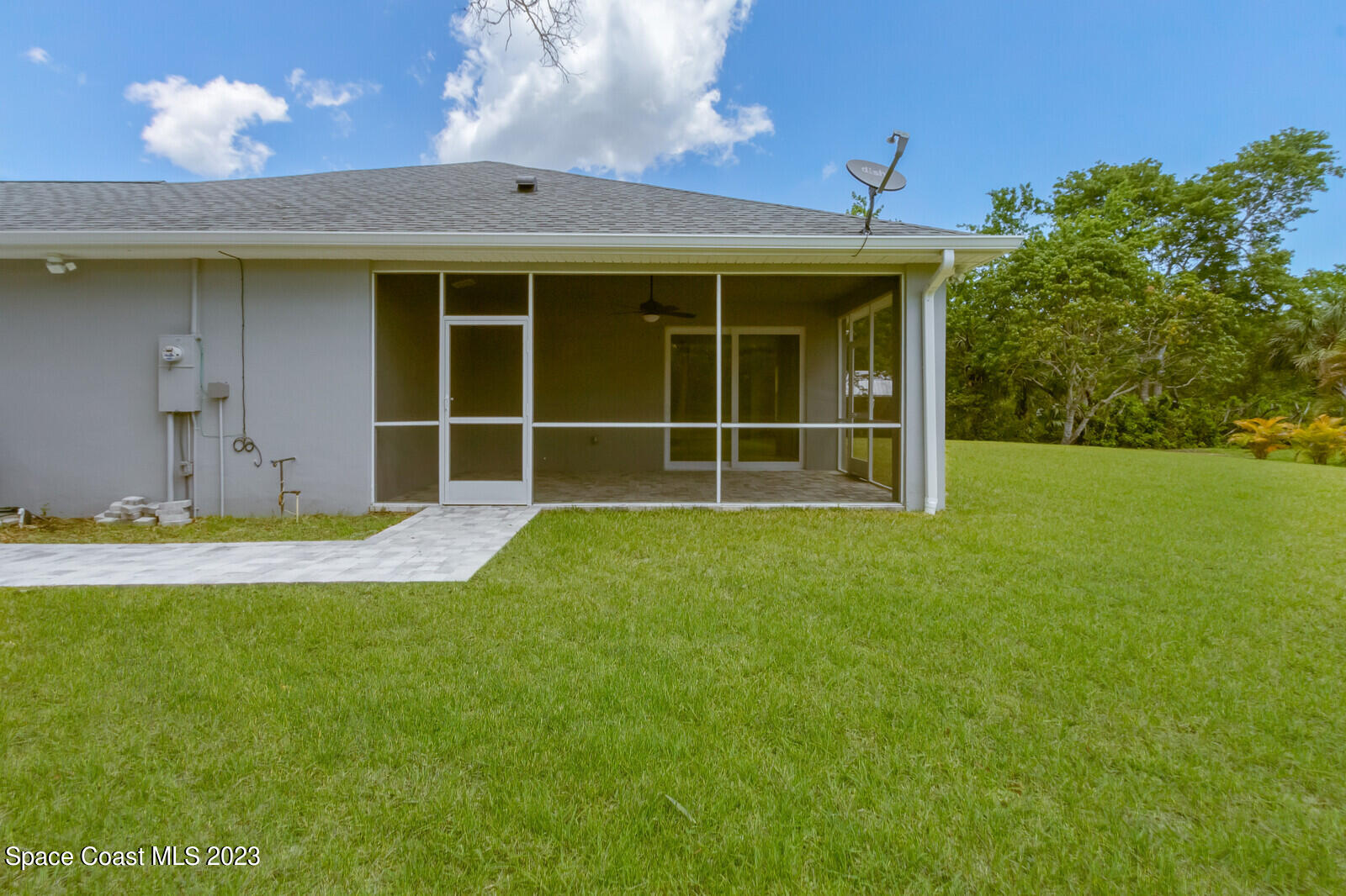 618 Hammock Road Melbourne, FL 32904 - Photo 34 of 59 a view of a house with a yard and a large tree