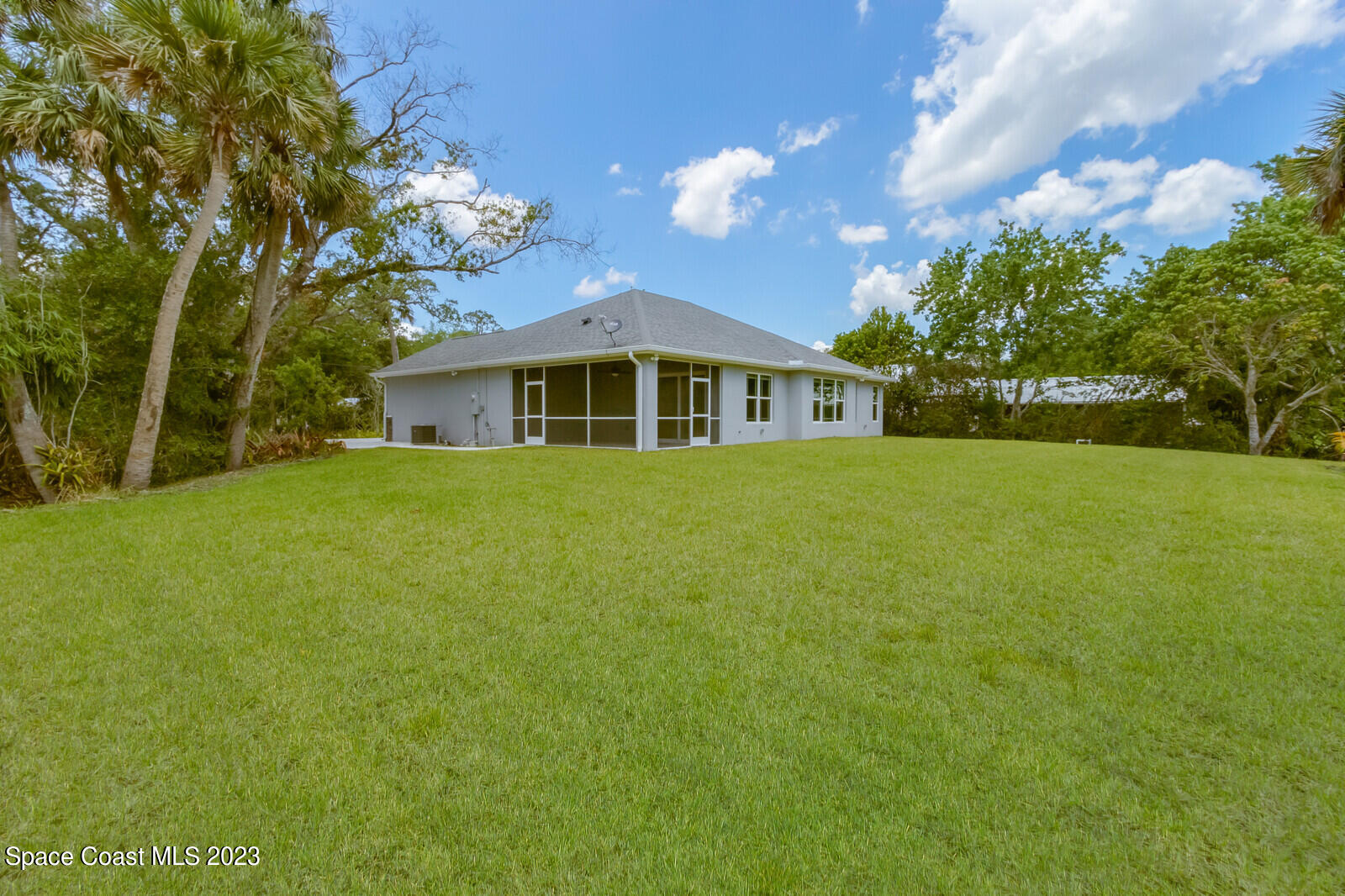 618 Hammock Road Melbourne, FL 32904 - Photo 35 of 59 a view of a house with a big yard