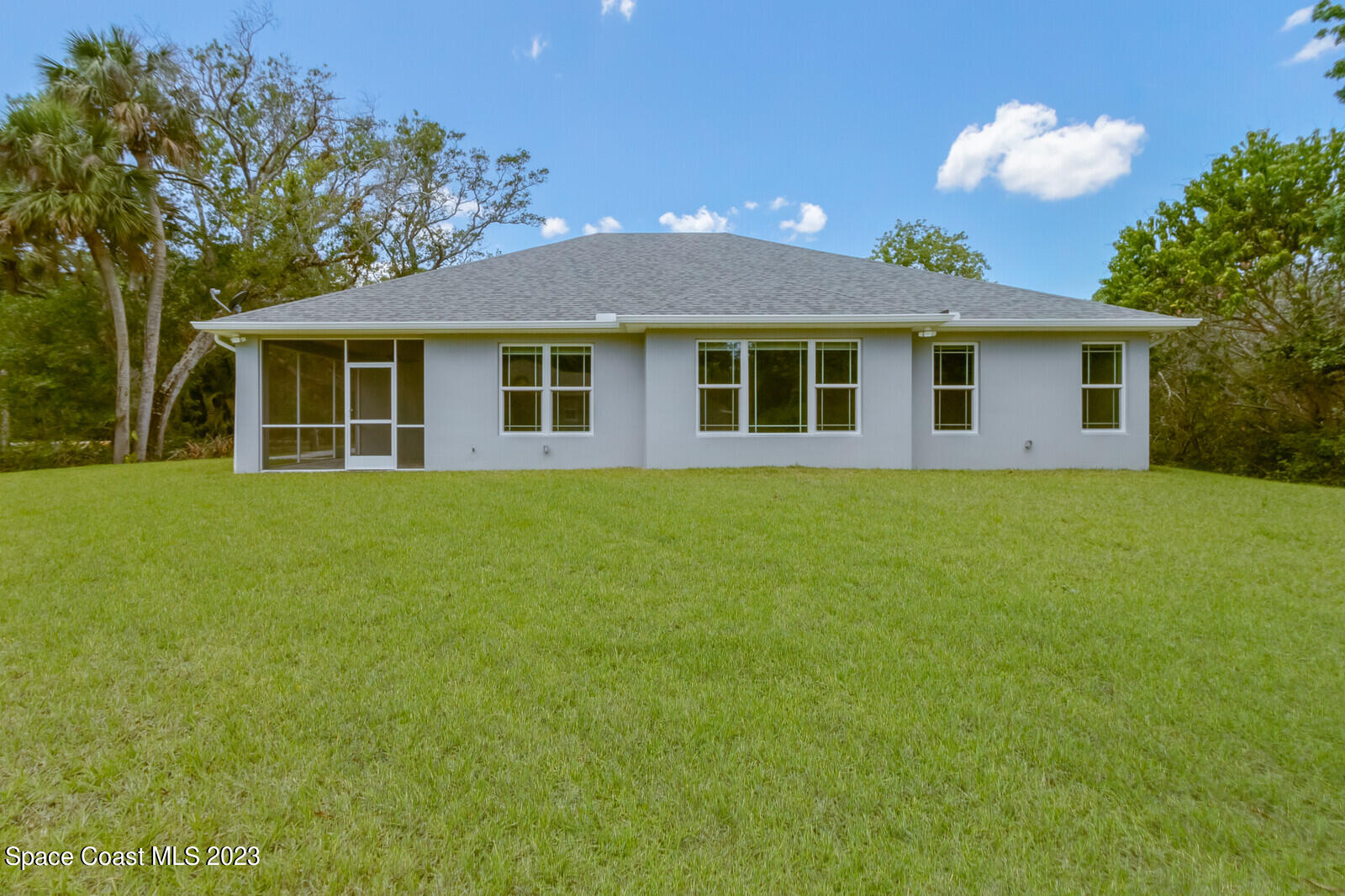 618 Hammock Road Melbourne, FL 32904 - Photo 37 of 59 a front view of house with yard and green space