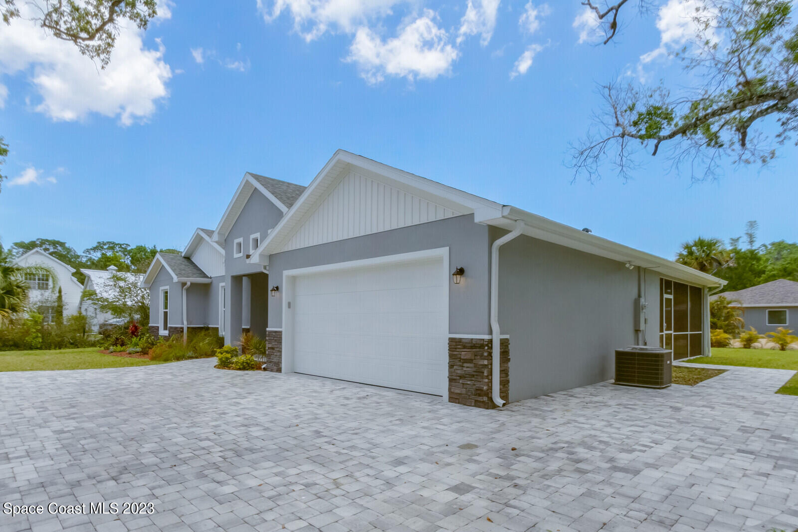 618 Hammock Road Melbourne, FL 32904 - Photo 38 of 59 a view of the house with outdoor space and sitting area