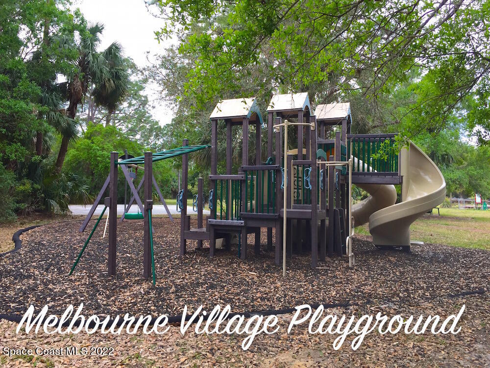618 Hammock Road Melbourne, FL 32904 - Photo 44 of 59 a view of a wooden deck with a patio