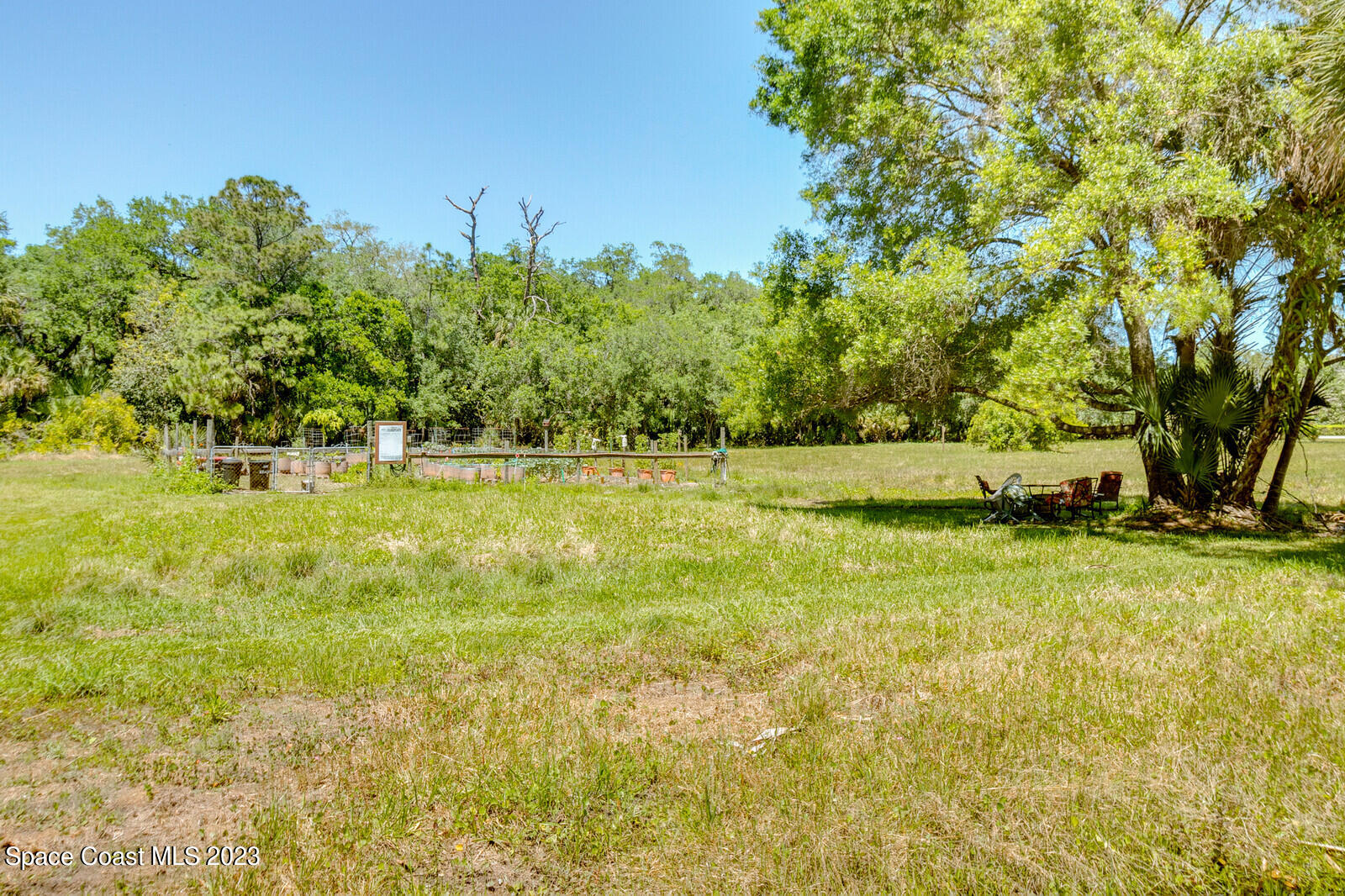 618 Hammock Road Melbourne, FL 32904 - Photo 49 of 59 a view of outdoor space with trees all around