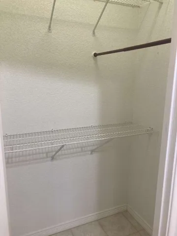 a view of a room with racks on the wall