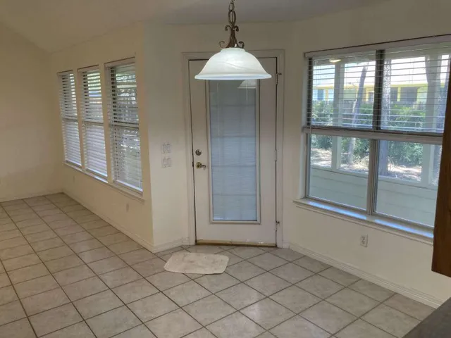 a view of an empty room and window