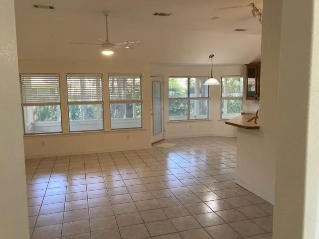 a view of an empty room with a window
