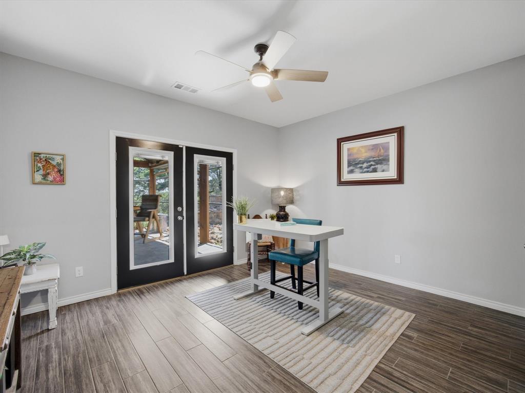 117 Ranchview Court Bowie, TX 76230 - Photo 22 of 40 a workspace with wooden floor