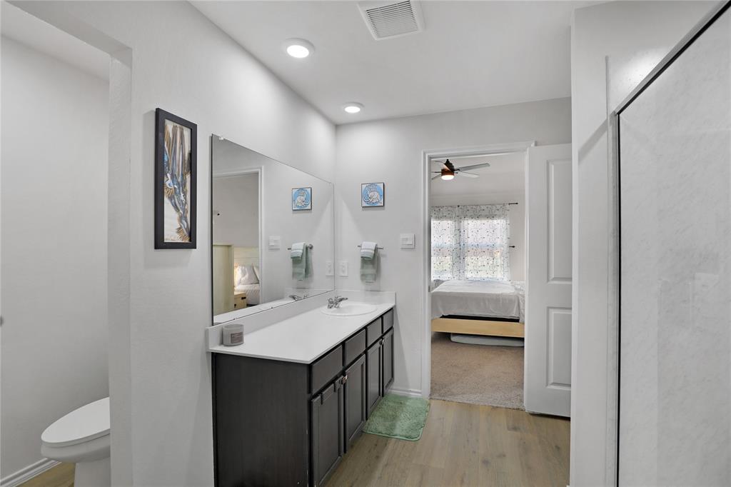 6538 Diver Street Princeton, TX 75407 - Photo 17 of 31 Ensuite bathroom with light wood-style floors, vanity, ceiling fan, a shower stall, and recessed lighting