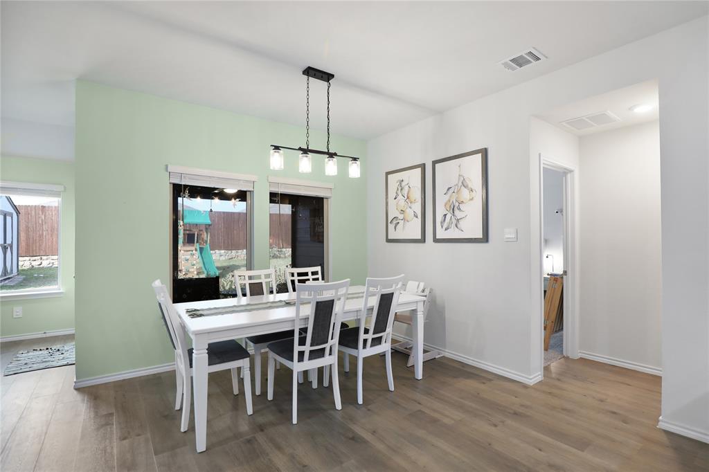 6538 Diver Street Princeton, TX 75407 - Photo 9 of 31 Dining space with wood finished floors