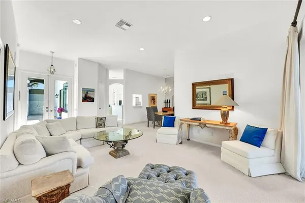 a living room with furniture or couch and a wooden floor