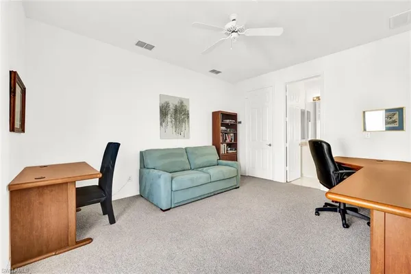a workspace with a couch and a desk
