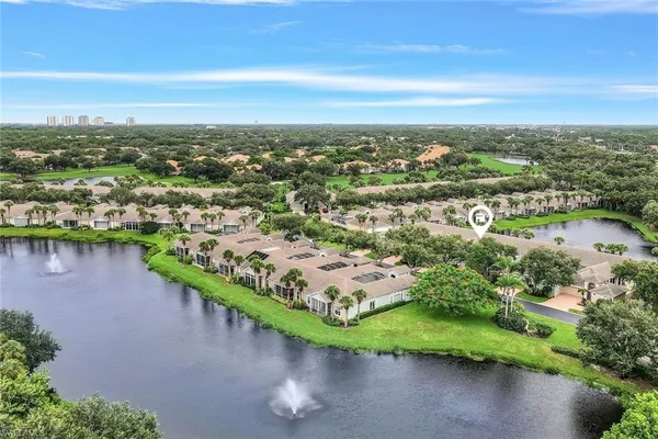 an aerial view of city and lake