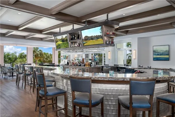 a kitchen with lots of counter top space and dining table
