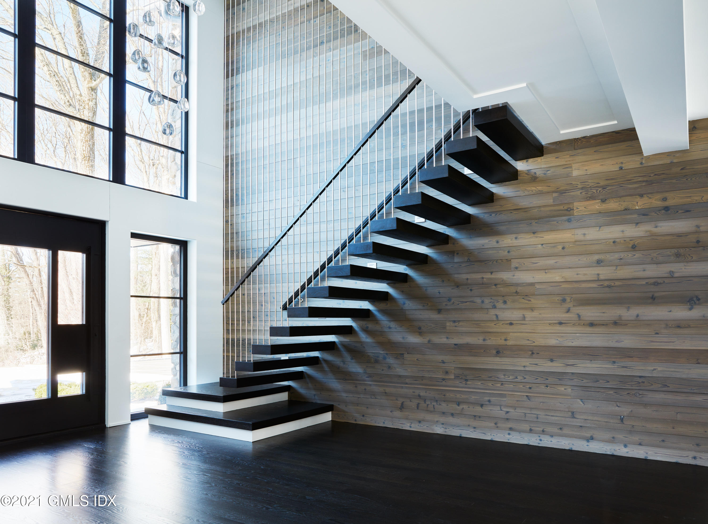 45 Husted Lane Greenwich, CT 06830 - Photo 2 of 11 a view of entryway with wooden floor