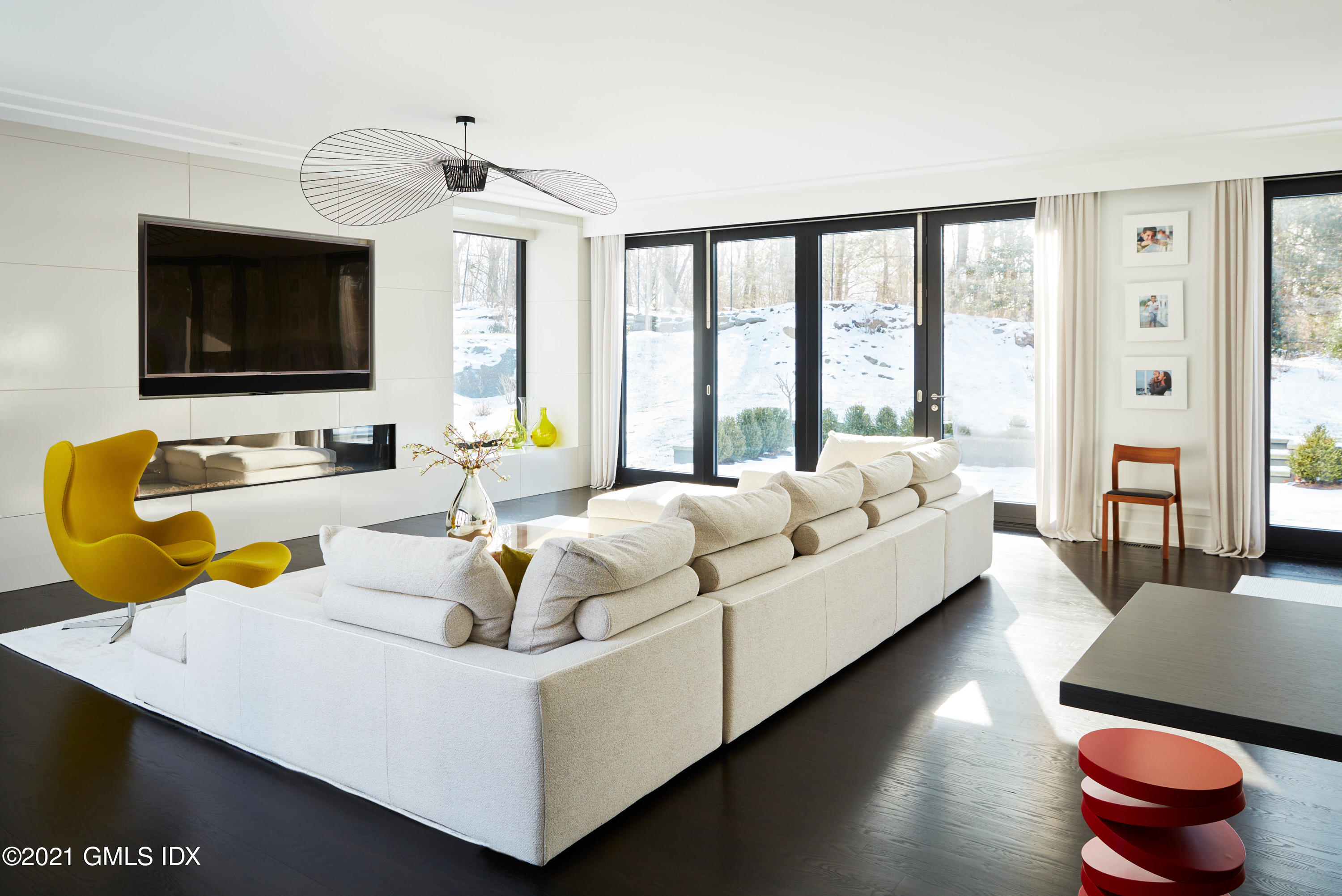 45 Husted Lane Greenwich, CT 06830 - Photo 7 of 11 a living room with furniture fireplace and flat screen tv