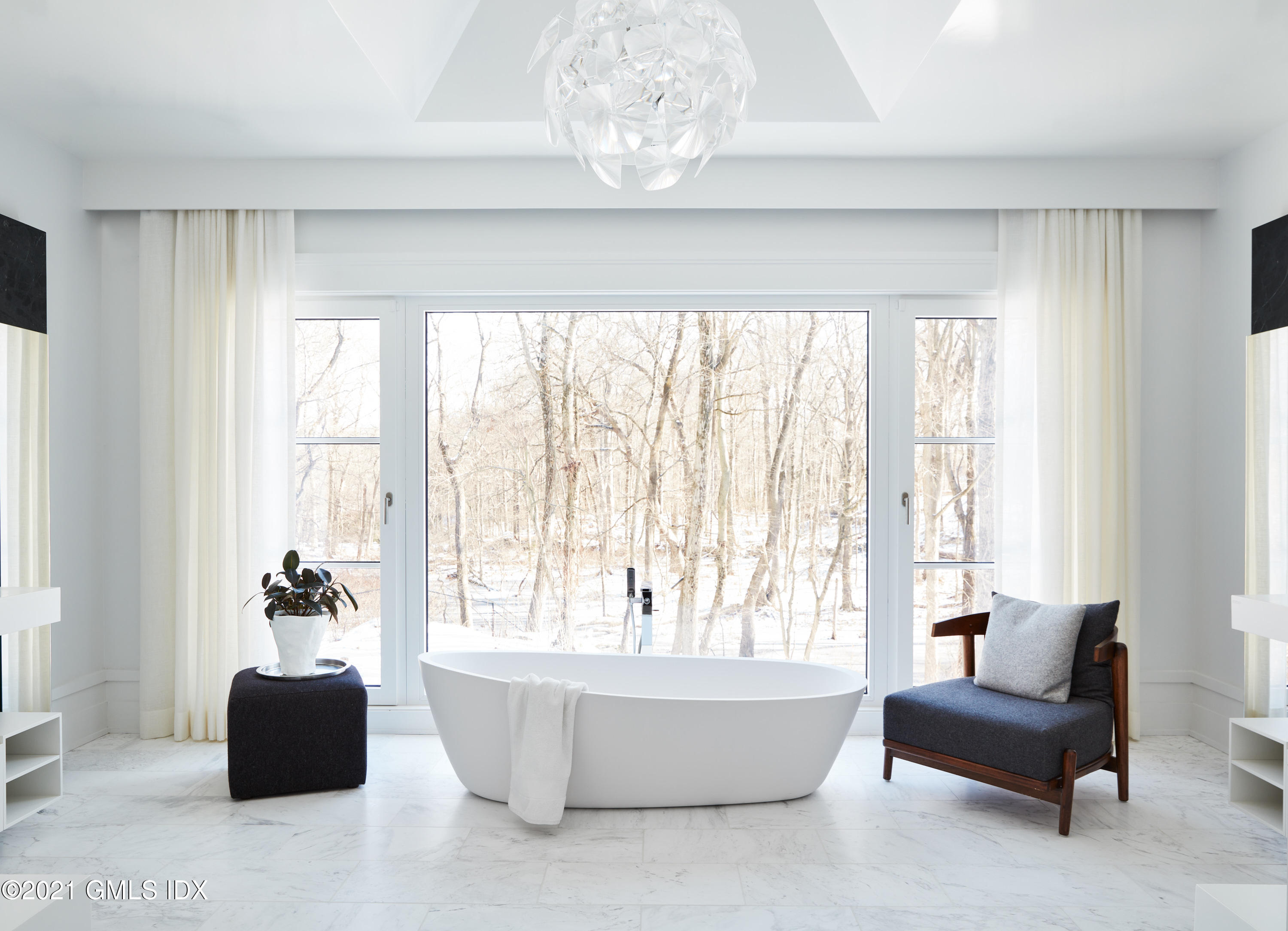 45 Husted Lane Greenwich, CT 06830 - Photo 9 of 11 a living room with furniture and a large window