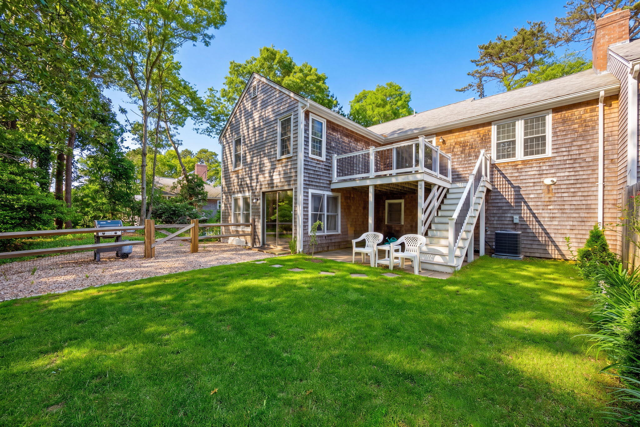 35 Debs Hill Road, Unit 35 Yarmouth Port, MA 02675 - Photo 36 of 36 a view of a house with backyard porch and sitting area