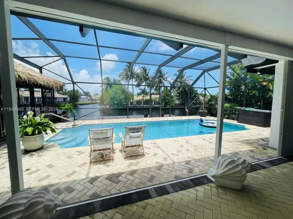 a view of a swimming pool with a patio