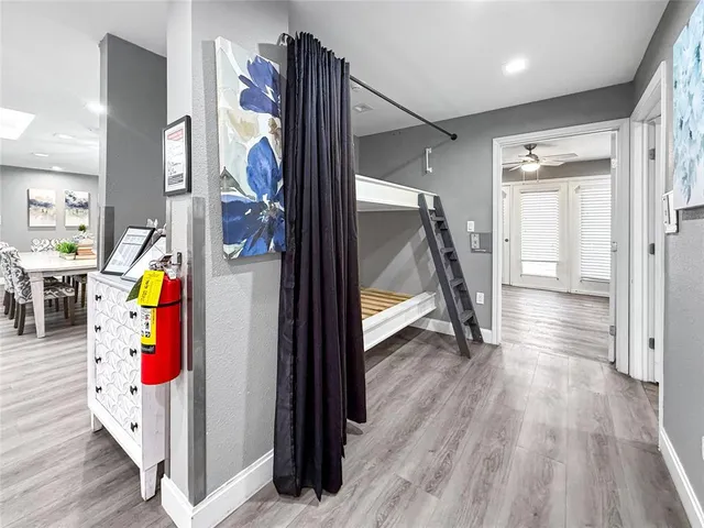 a view of an entryway with wooden floor and staircase