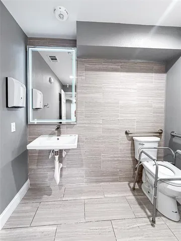 a bathroom with a sink and toilet