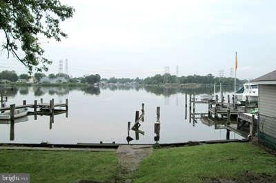 8208 Northview Road Baltimore, MD 21222 - Photo 3 of 5 a large body of water with a building in the background