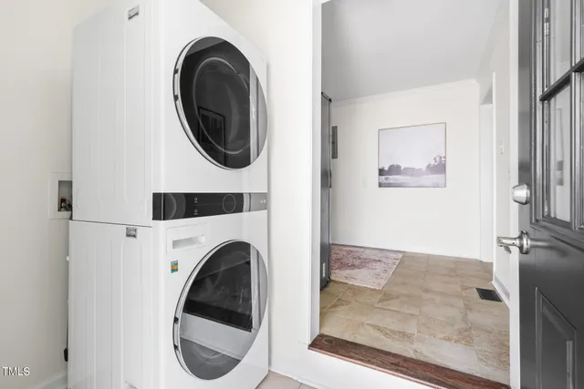 a view of a hallway with washer and dryer