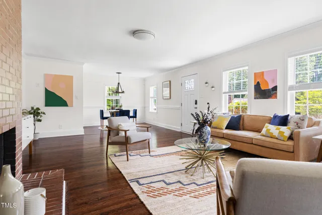 a living room with furniture or couch and a wooden floor