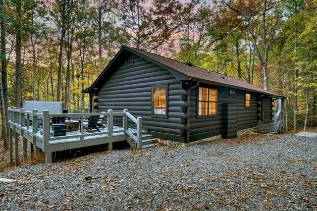 a view of backyard with deck and seating area