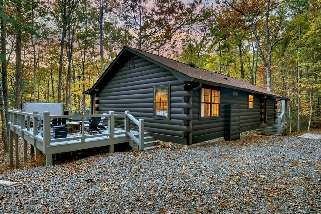 a view of backyard with deck and seating area