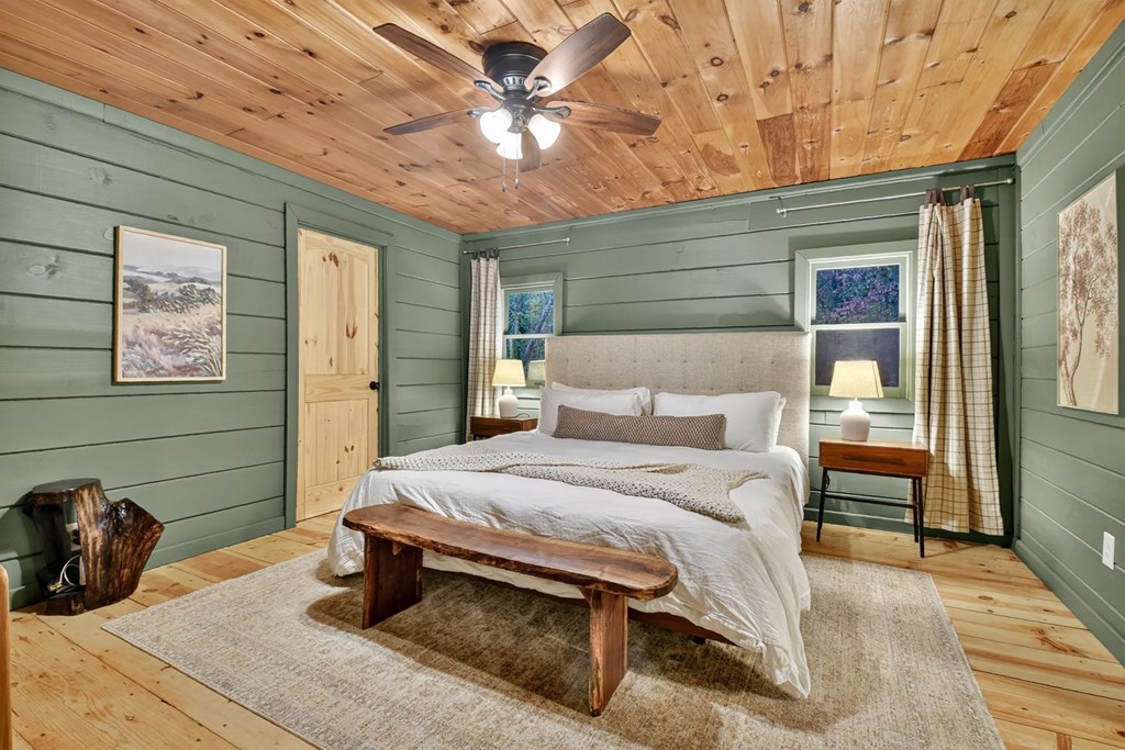 50 Lake View Drive Cherry Log, GA 30522 - Photo 13 of 27 a bedroom with a bed and a chandelier