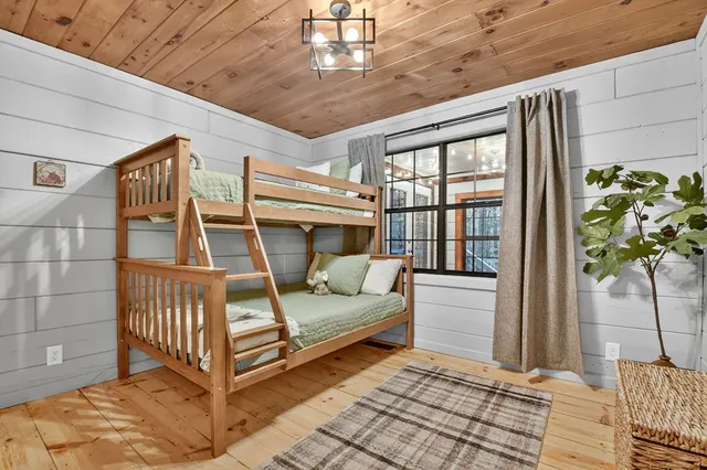 a bedroom with furniture and window