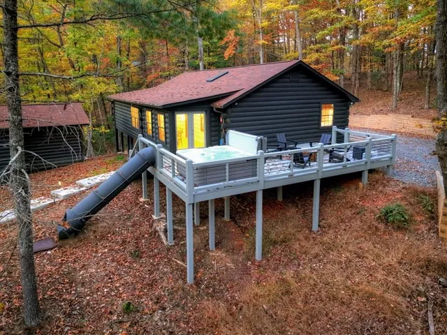 a backyard of a house with table and chairs