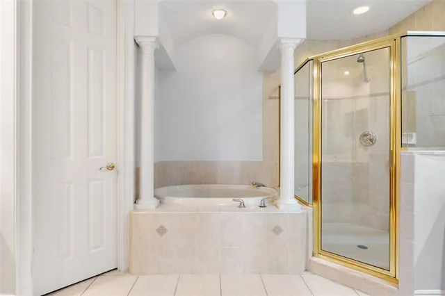 a bathroom with a bathtub and a shower