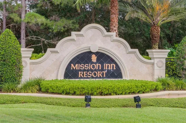 a view of front of a house with a garden