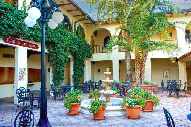 a front view of multiple house with outdoor seating