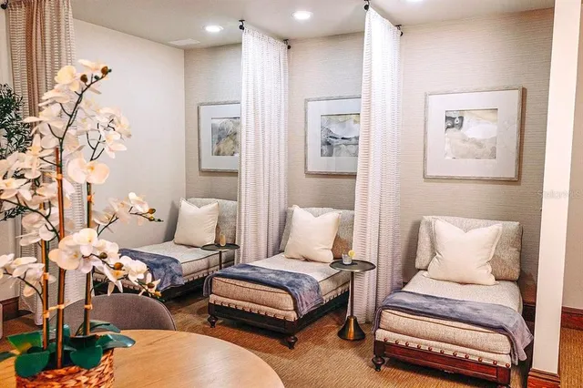 a bedroom with furniture and wooden floor