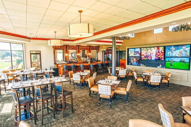 a outdoor space with tables and chairs