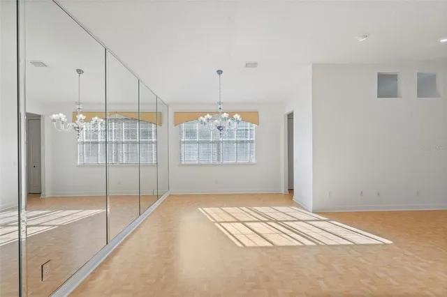 a view of an empty room with glass door