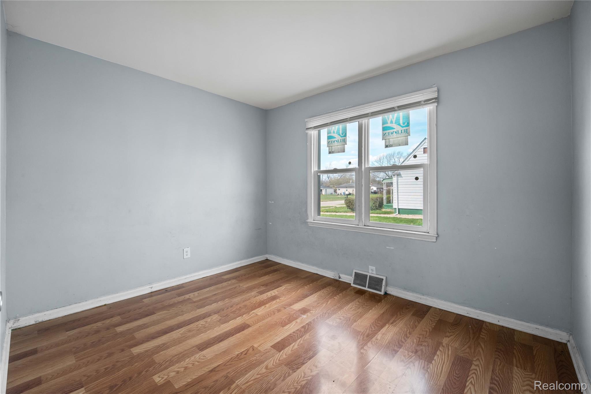 4049 Williams Street Inkster, MI 48141 - Photo 13 of 21 Empty room featuring wood finished floors and baseboards