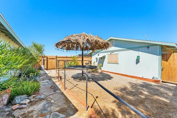 a view of a backyard with a sitting area